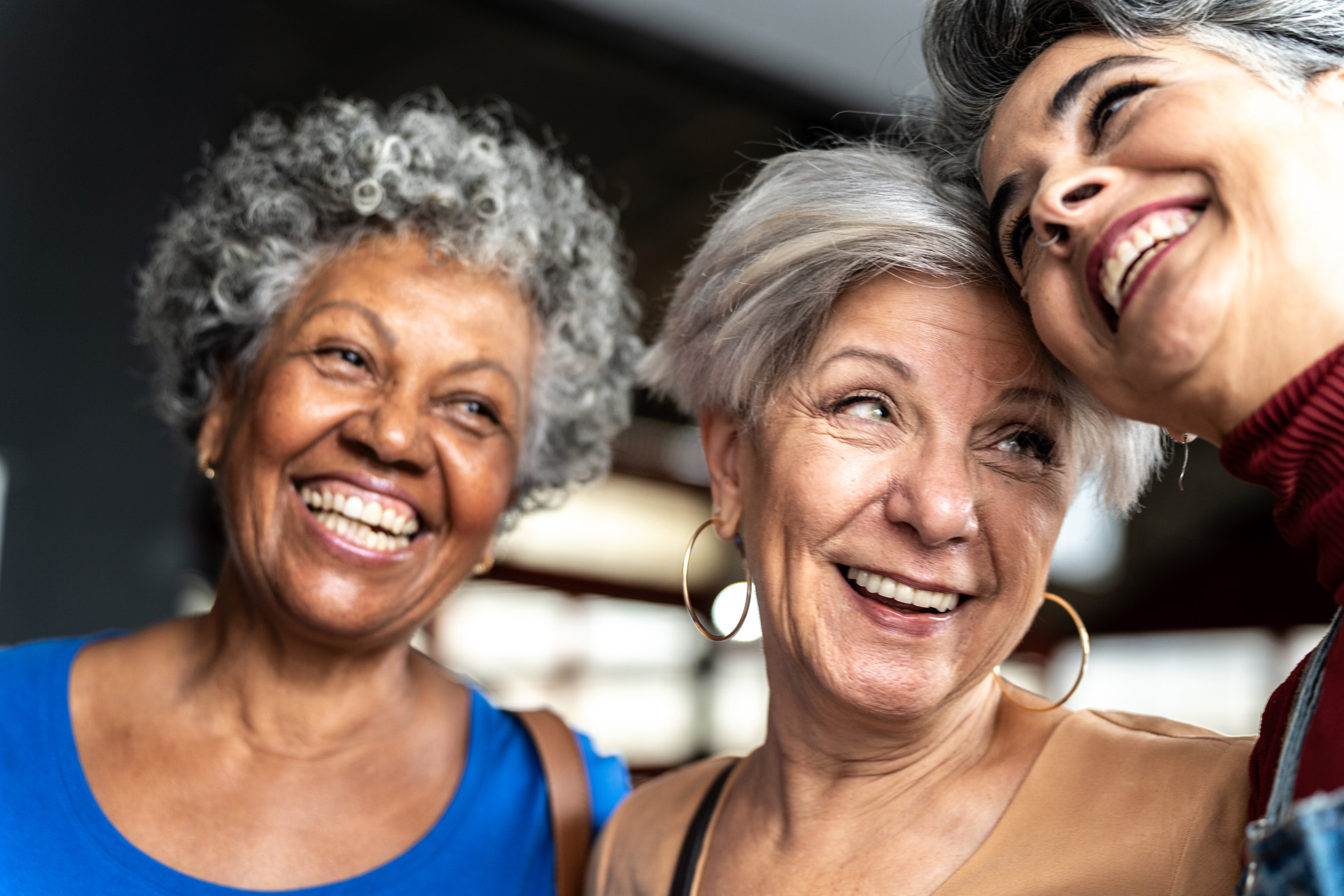 close-up of three senior woman smiling together