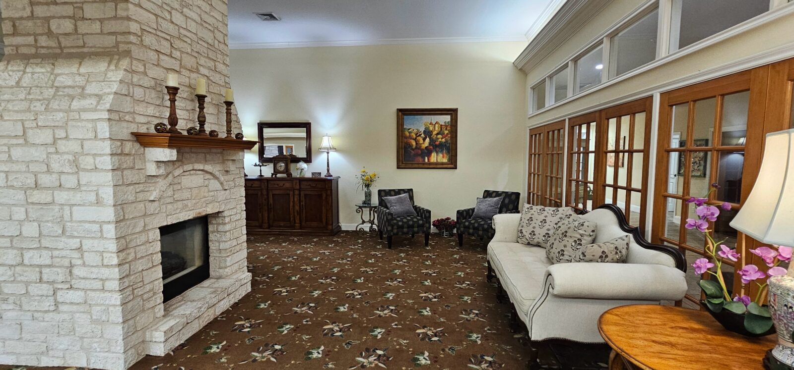 Cozy living room with fireplace and elegant furnishings.